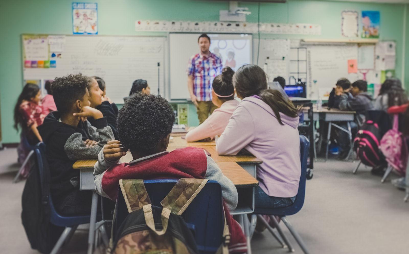 Secondary school pupils in a classroom lesson with their teacher